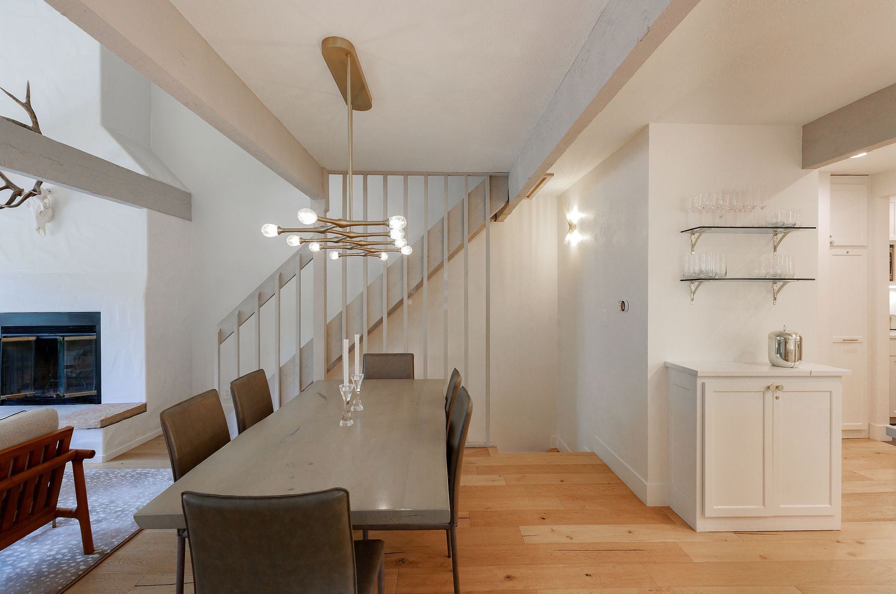 Dining with floating-tread stair and antler accent