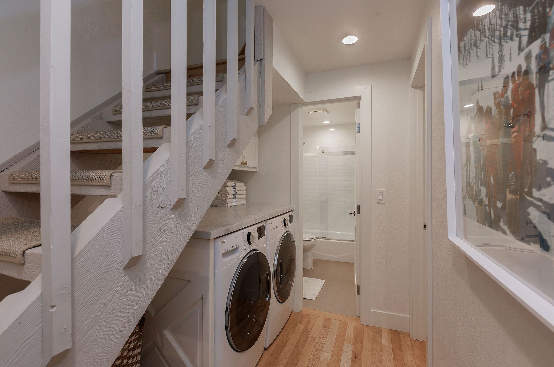 Tucked laundry with full-size washer and dryer