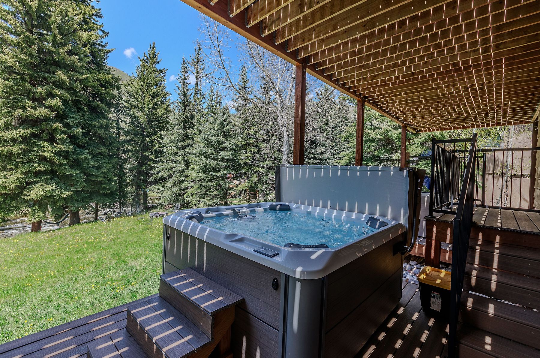 Hot tub set against the spruce treeline