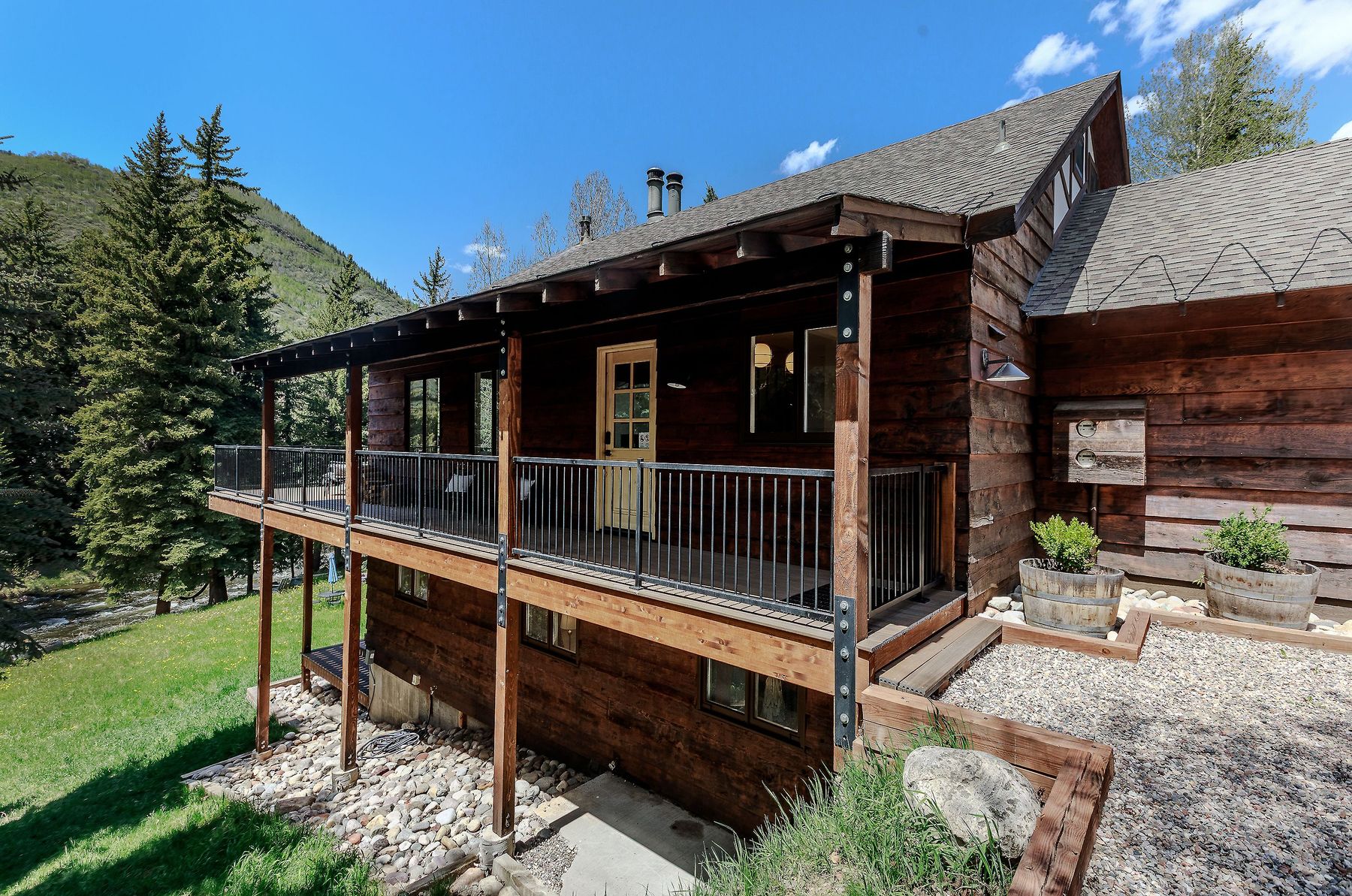 Side deck with hammock and creek view